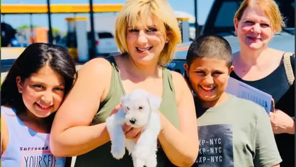 A Showtime Pups puppy with its new family