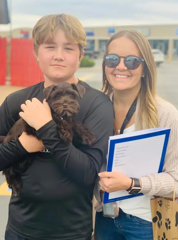 A Showtime Pups puppy with its new family