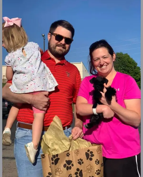 A Showtime Pups puppy with its new family