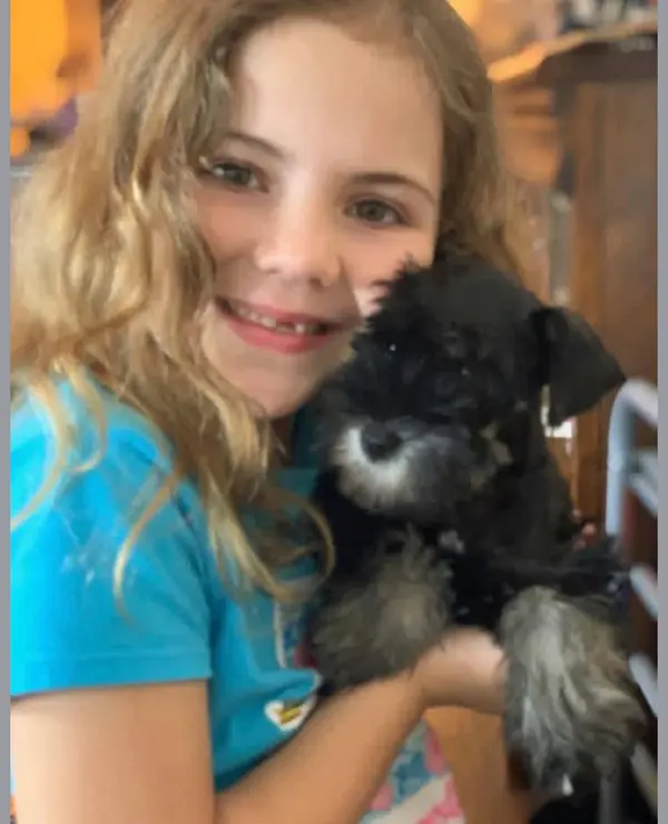 A Showtime Pups puppy with its new family