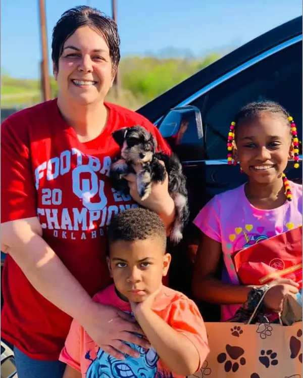 A Showtime Pups puppy with its new family