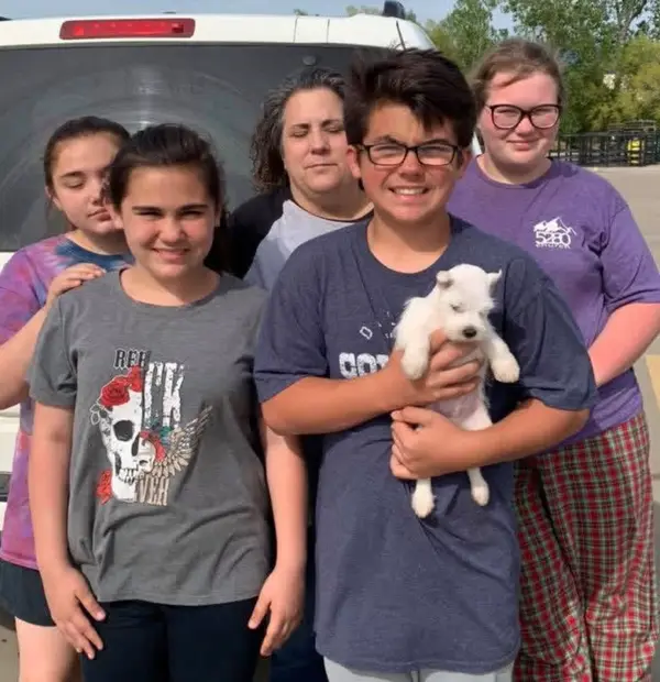 A Showtime Pups puppy with its new family
