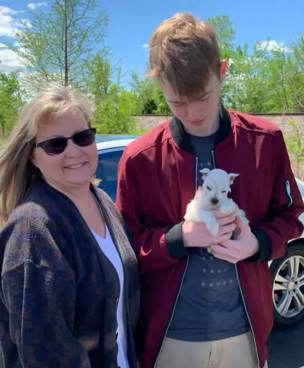 A Showtime Pups puppy with its new family