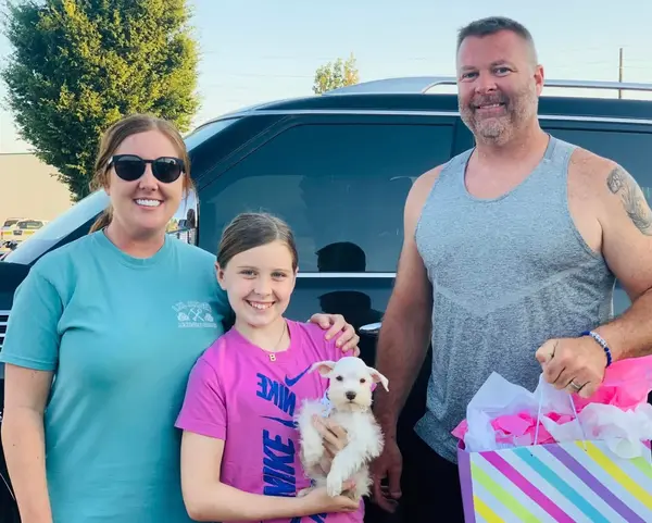 A Showtime Pups puppy with its new family