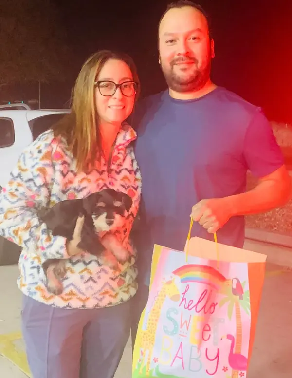 A Showtime Pups puppy with its new family
