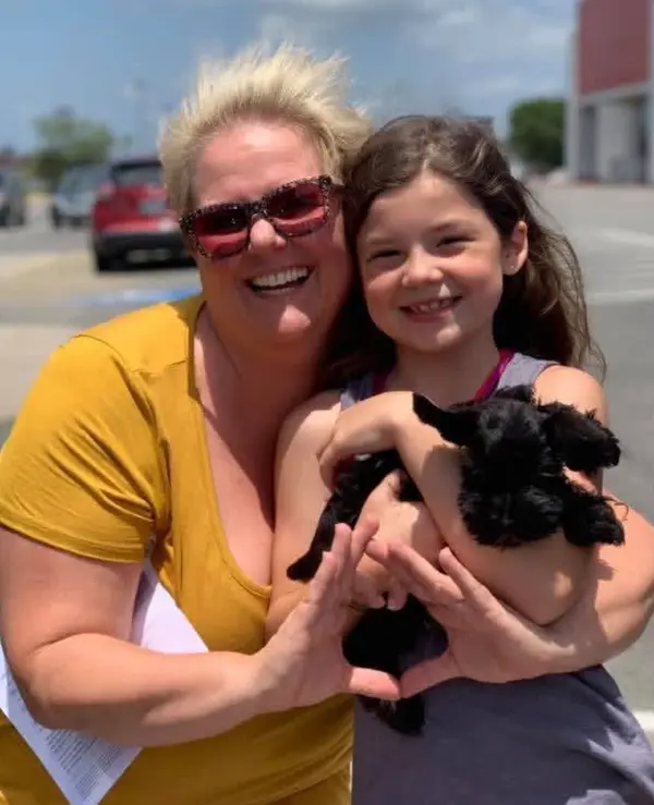 A Showtime Pups puppy with its new family
