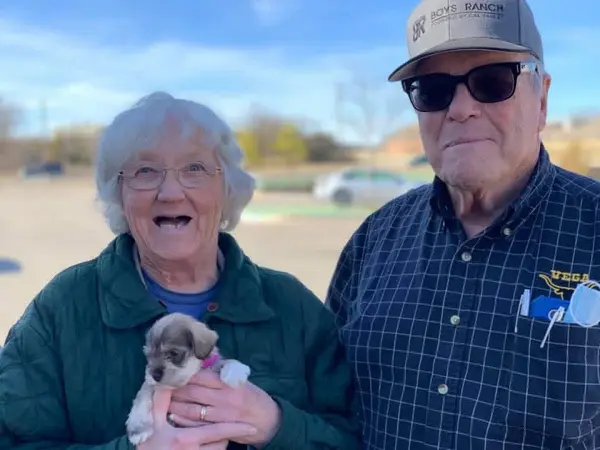A Showtime Pups puppy with its new family