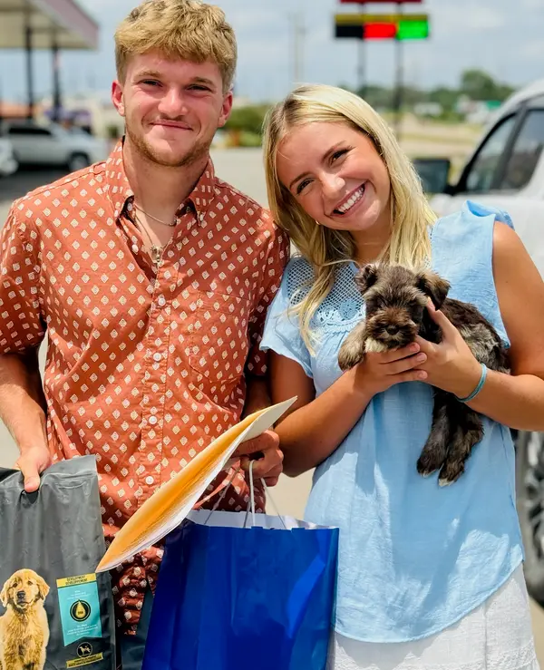 A Showtime Pups puppy with its new family