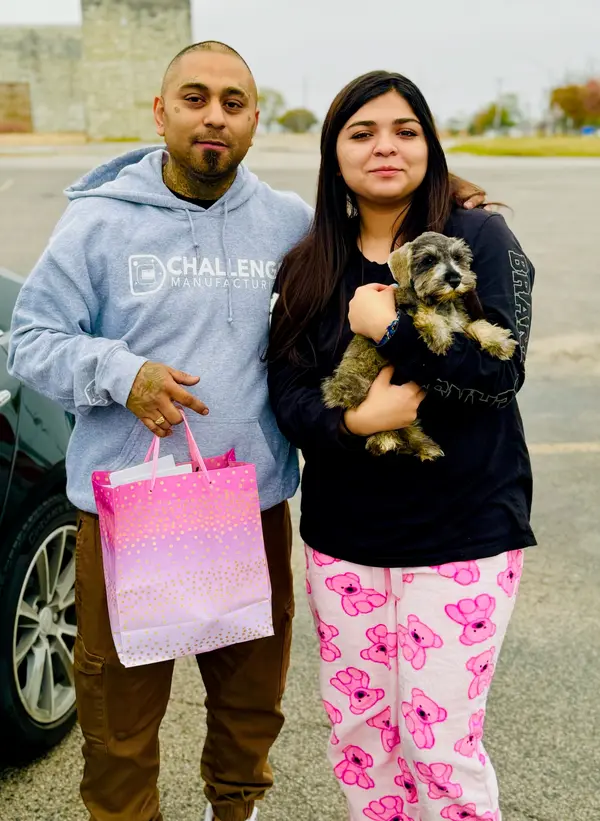 A Showtime Pups puppy with its new family