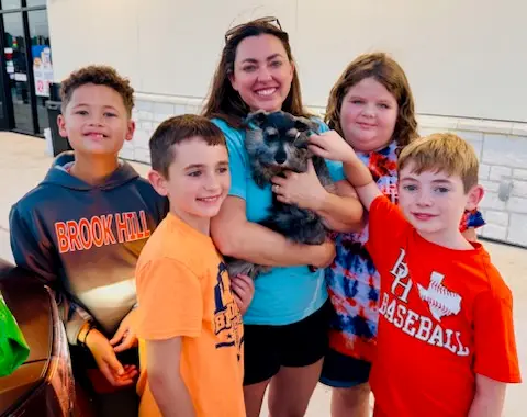 A Showtime Pups puppy with its new family