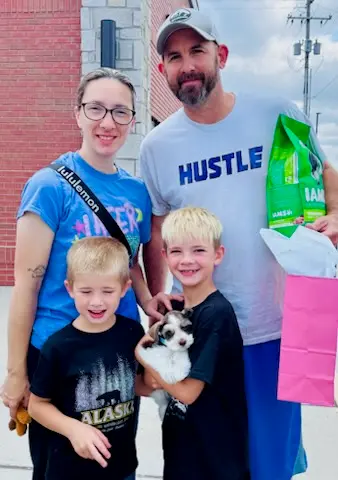 A Showtime Pups puppy with its new family